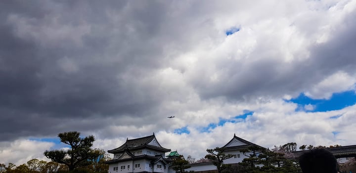The surroundings of Osaka Castle in spring season with beautiful sky, calm river and cherry blossom. photo