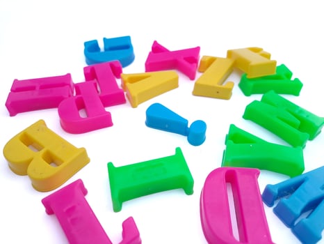 Close up of colorful alphabets on white background perfect for children's education photo