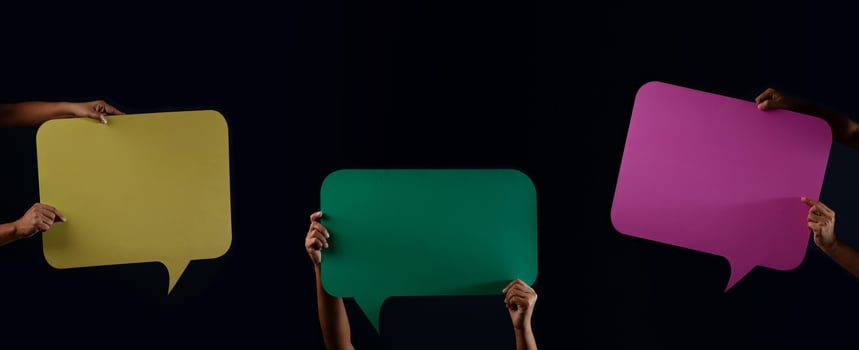 Colorful Blank Speech Bubble. Protest or Freedom to Speak Concept. Group of People Raised up Empty Speech Paper photo