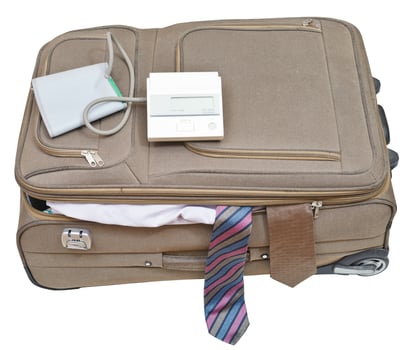 sphygmomanometer on suitcase with male ties photo