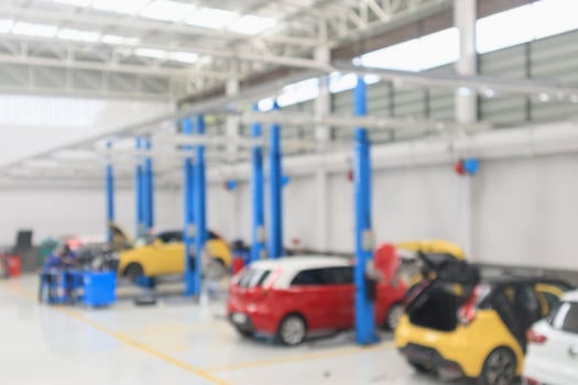 car service centre with auto at repair station bokeh light defocused blur background photo