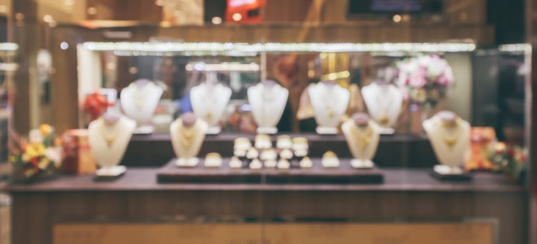 Gold jewelry diamond store window display abstract blur with bokeh light background photo
