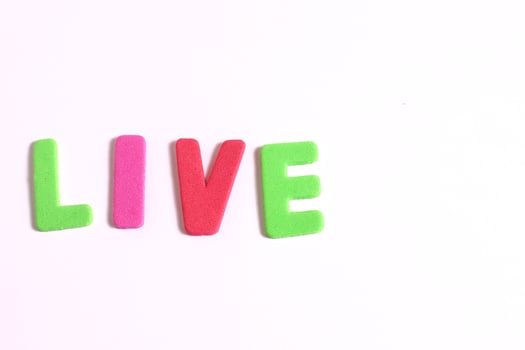Lettering live word, colored letters on white photo