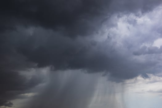 The dark sky with heavy clouds converging and a violent storm before the rain.Bad weather sky. photo