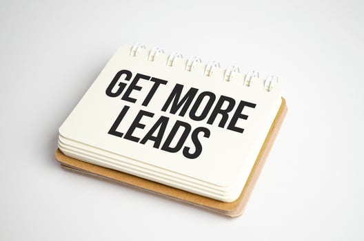 Get More Leads text as memo on notebook photo