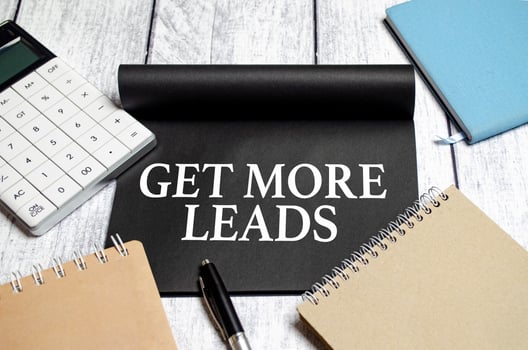 Get More Leads text as memo on notebook with pen photo