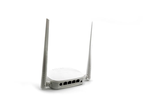 White wireless internet router with two antennas isolated on white photo