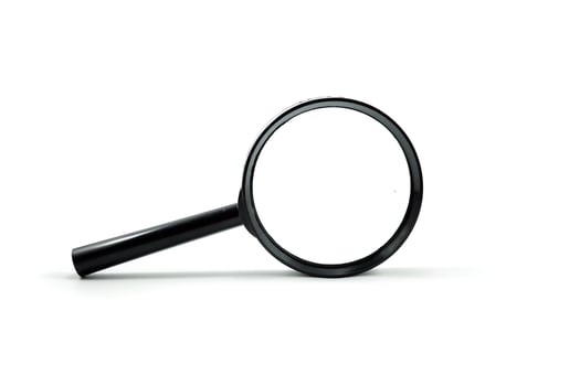 Close up single magnifying glass isolated on a white photo