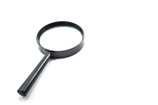 Close up single magnifying glass isolated on a white photo