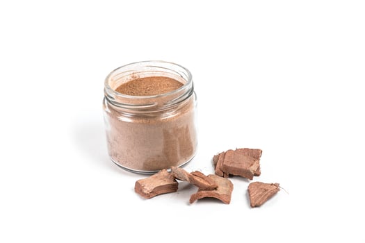 Dry arjun chal powder or Terminalia arjuna ayurvedic herb on white background photo