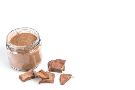 Dry arjun chal powder or Terminalia arjuna ayurvedic herb on white background photo