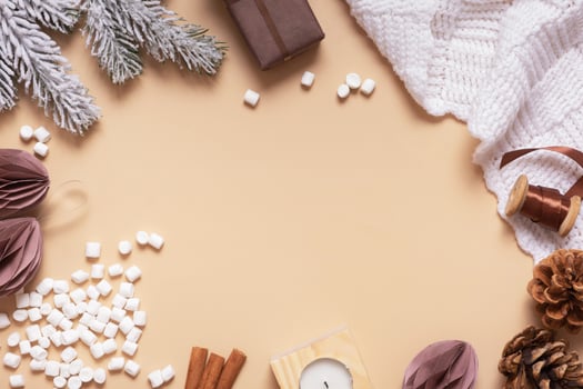 Christmas hugge flat lay composition with gifts, paper balls, plaid and marsh mellow top view photo