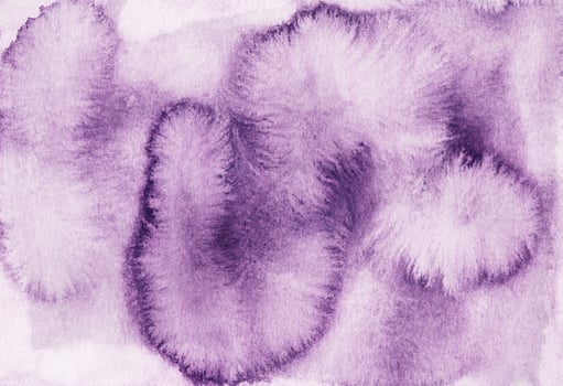 Watercolor violet stains on white paper background. Hand painted photo