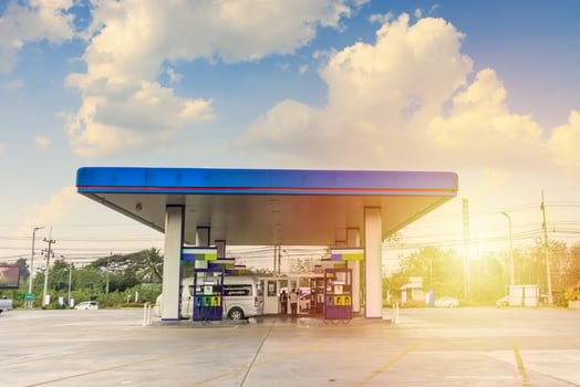 Petrol gas fuel station with clouds and blue sky photo
