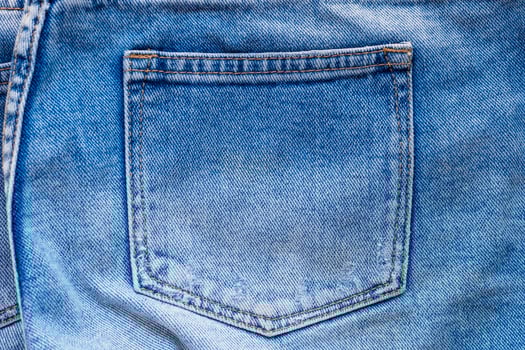Blue denim jeans back pocket close up photo