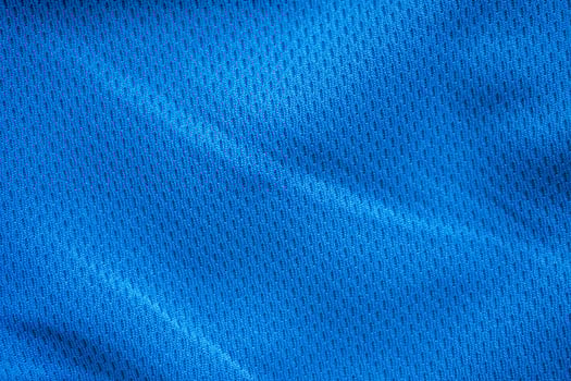 Blue fabric sport clothing football jersey with air mesh texture background photo