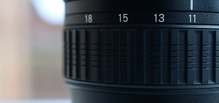 Fragment of a wide angle zoom lens for a modern SLR camera. The set of distance values is indicated by white numbers on the black body photo