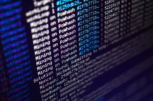 Macro snapshot of the program interface for crypto currency mining on the monitor of an office computer. The concept of mining bitcoins. The flow of information strings and data photo