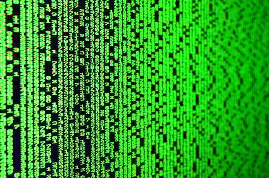 Macro of password selection on the monitor of the office computer. The concept of hacking the protection of a personal data keeper. The stream of supposed digital passwords of four and five digits photo