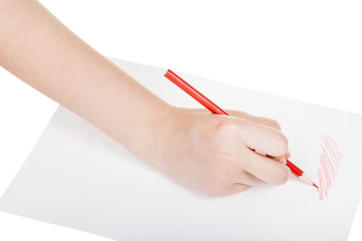 hand draws by red pencil on sheet of paper photo