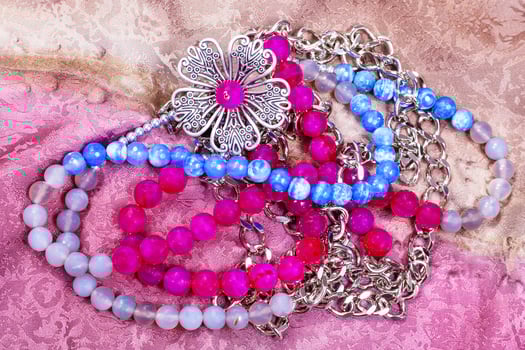 tangled necklace from gemstones with metal flower photo