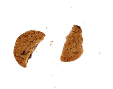 round chocolate chip cookie with crumbs isolated on white background photo