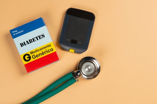 Fake medicine box with the name of the disease Diabetes and a glucometer. photo
