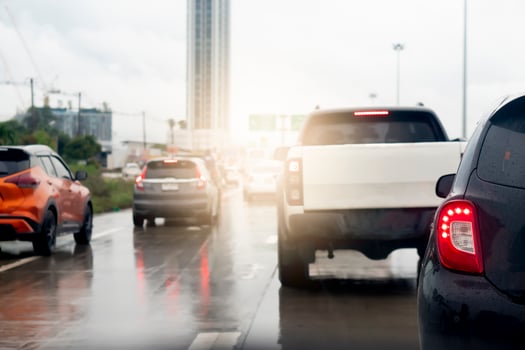 Abstract of rear back car. Rear side view of car in rainy time and traffic jam. Traffic congestion with many queues due to the wet asphalt road surface. photo