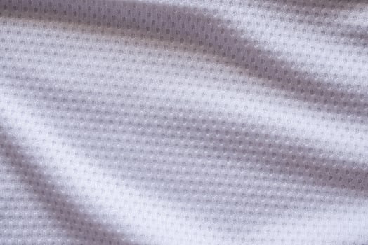 White fabric sport clothing football jersey with air mesh texture background photo
