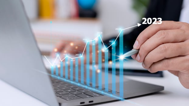 Businessman analyzes profitability of working companies with digital augmented reality graphics, positive indicators in 2023, businessman calculates financial data for long-term investments. photo