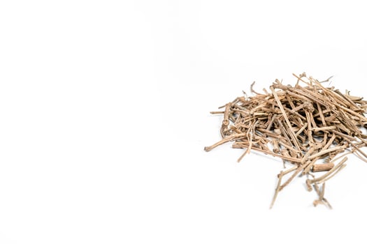 Organic dry barks of Indian Jalap or Nishodh or Operculina turpethum isolated on white background photo