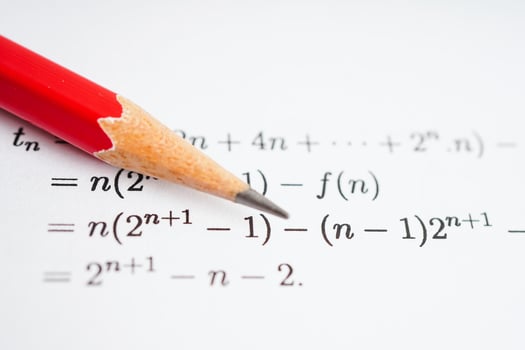 Pencil on mathematic formula exercise test paper in education school. photo