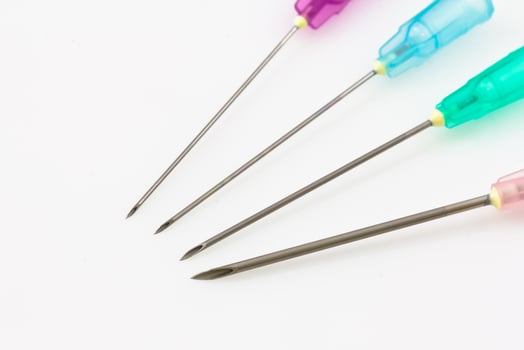medical syringe needle isolated on white photo
