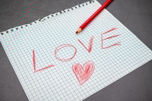 Notebook sheet of paper with a handwritten love message photo