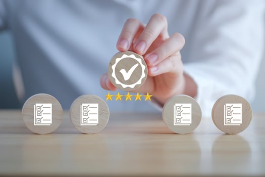 Businessman hand holding sign of the top service Quality assurance with 5 star, Guarantee, Standards, ISO certification, standardization concept, advertising product and service quality commitment. photo