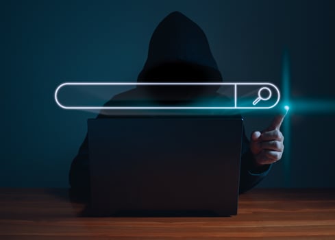 Hackers work on laptops in the dark. The concept of information security in the Internet network and information espionage. photo