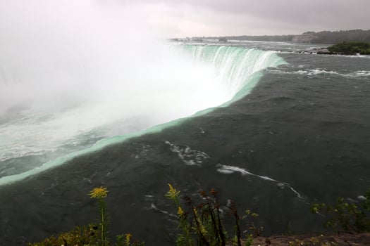 Canadian Falls on the Niagara River on an autumn rainy day. photo