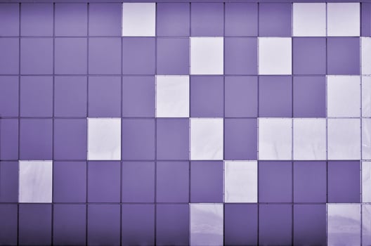 The texture of the metal wall, framed in the form of colored squares of two colors. Modern wall design for the exterior of residential and office buildings photo