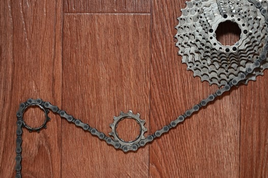 Some composition of a bicycle chain, several sprockets and other components of a sports bike photo