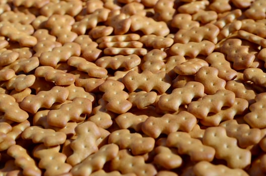 Pattern of a many yellow salted crackers photo