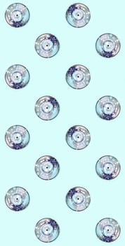 Many used spray cans for graffiti drawing lies on a pastel colored backgroung. Street art painting concept. Minimal flat lay pattern. Top view photo