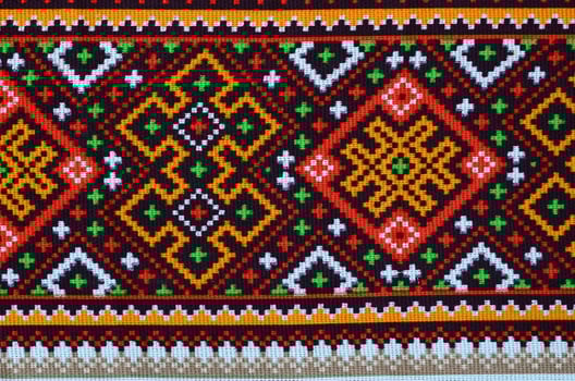 Traditional Ukrainian folk art knitted embroidery pattern on textile fabric photo