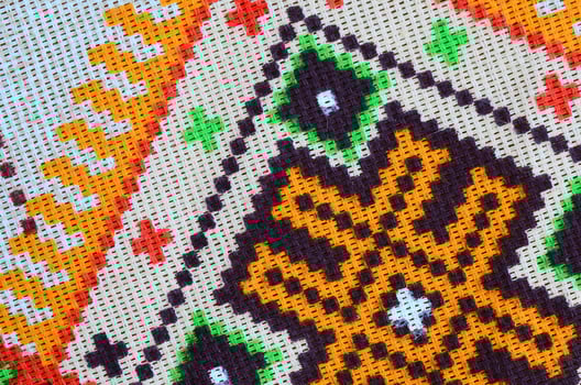 Traditional Ukrainian folk art knitted embroidery pattern on textile fabric photo