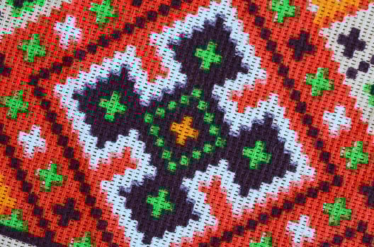 Traditional Ukrainian folk art knitted embroidery pattern on textile fabric photo