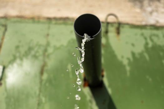 Water pours out of pipe. photo