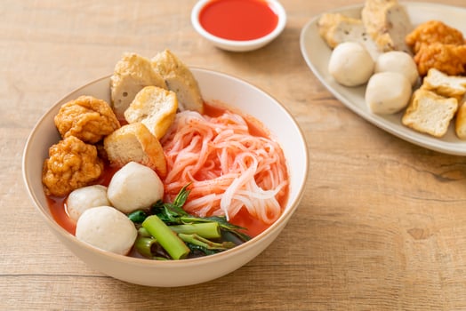 small flat rice noodles with fish balls and shrimp balls in pink soup, Yen Ta Four or Yen Ta Fo photo