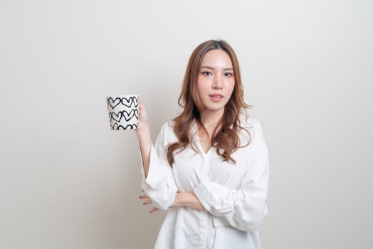 portrait beautiful Asian woman holding coffee cup or mug photo