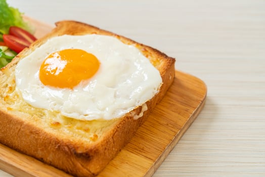 bread toasted with cheese and fried egg photo