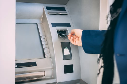 Close up of withdrawing money from ATM. photo