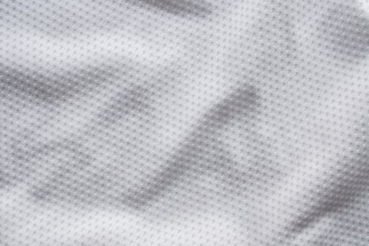 White fabric sport clothing football jersey with air mesh texture background photo